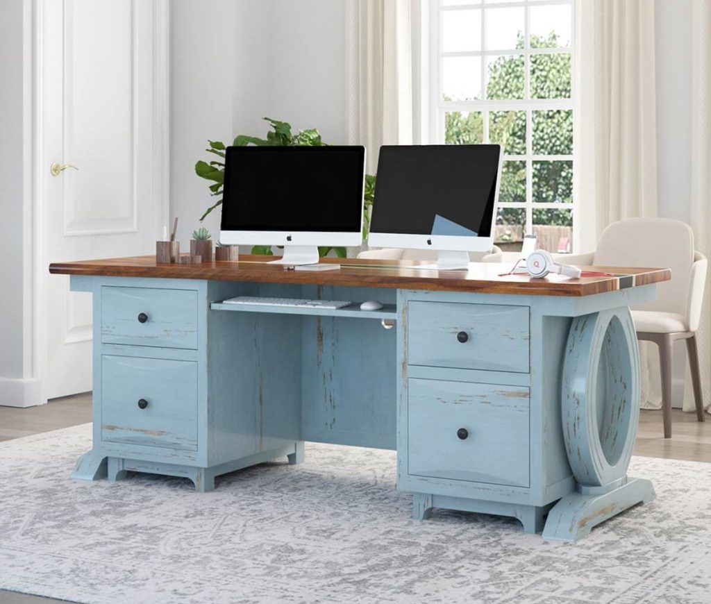 light blue solid wood desk having two monitors placed on it.