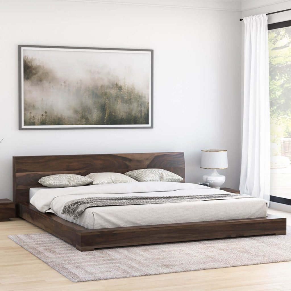 King size Solid wood low profile platform bed having painting on white wall