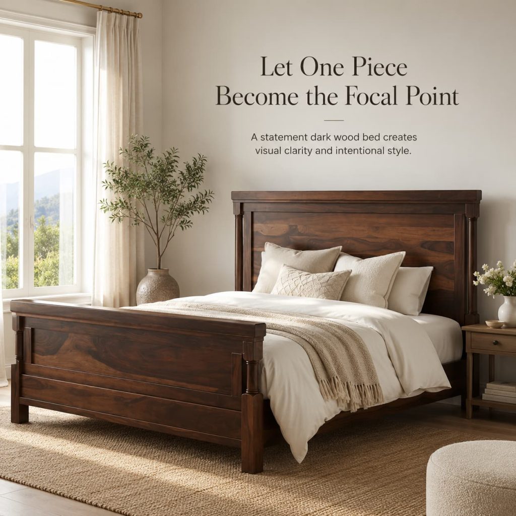 Statement dark wood bed styled as the centerpiece of an elegant bedroom