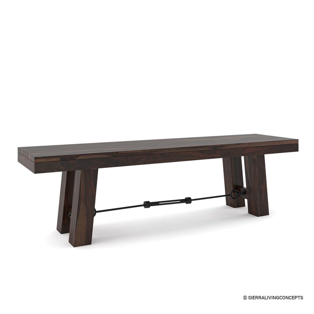 Dark wood dining bench with angled legs and a wrought-iron support bar