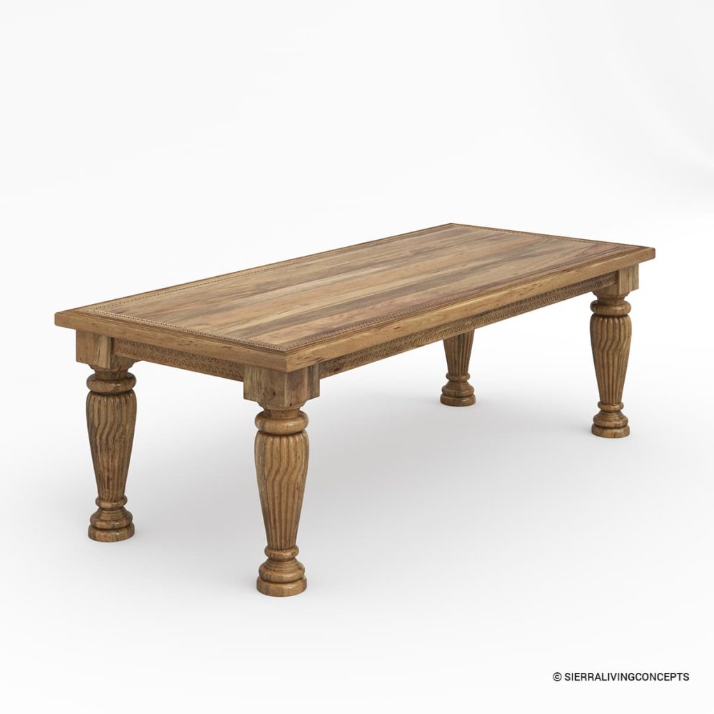 Rustic wood dining table with carved turned legs and a decorative edge.