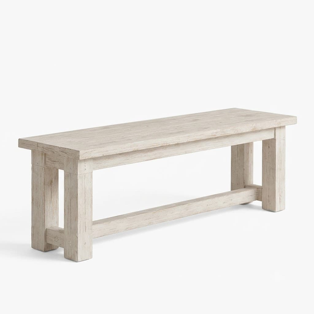 Whitewashed wood dining bench with a trestle base.